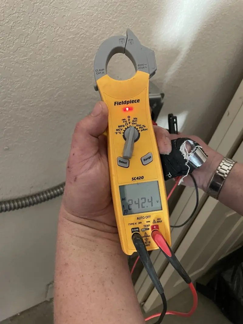 Voltage testing with clamp meter during Hot Tub / Pool Electrical Wiring in Dellwood